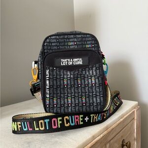 Awful Lot of Cough Syrup X Cure Black Crossbody Bag